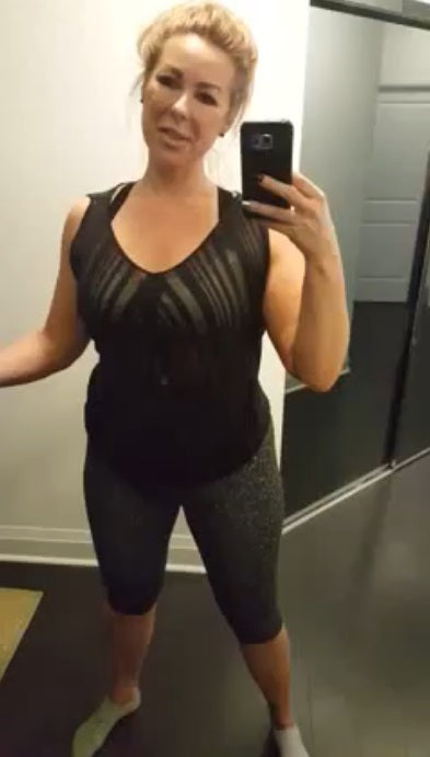 Woman wearing Mass & Slim anti-cellulite shapewear shorts taking a mirror selfie.