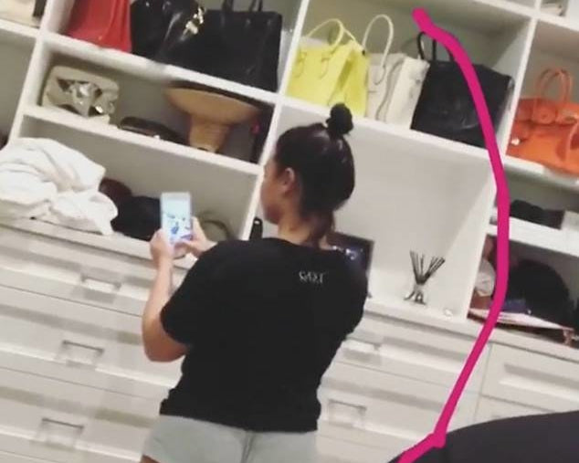 Woman taking a mirror selfie in underwear with visible cellulite, standing confidently in front of a closet. Text overlay reads "CELLULITE AND YET, I STILL LOVE MYSELF" with a pink heart.