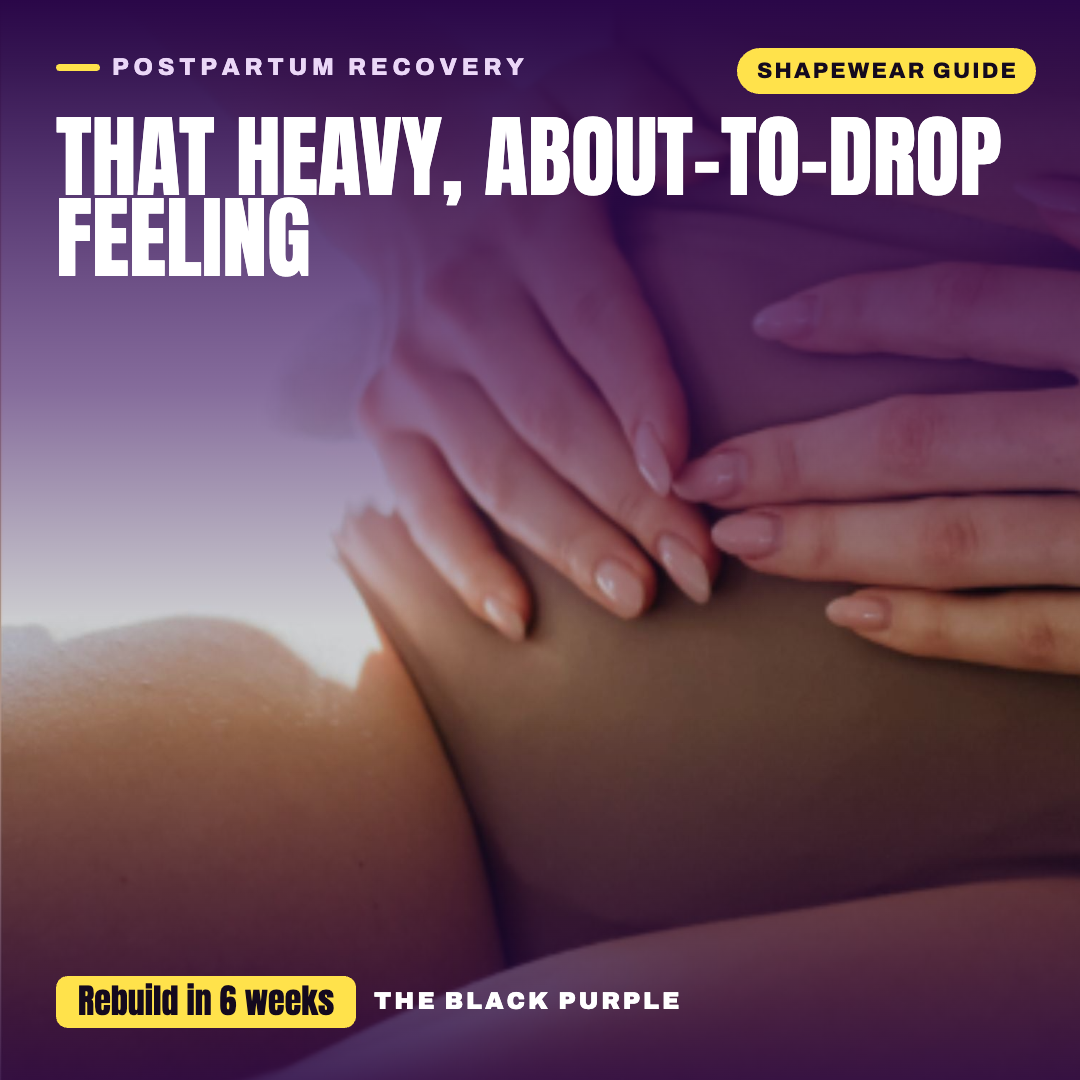 Woman's hands cradling her lower belly in nude postpartum shapewear — pelvic floor heaviness and instability recovery guide by TheBlackPurple.