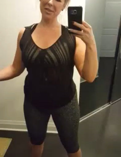 Woman wearing Mass & Slim anti-cellulite shapewear shorts taking a mirror selfie.